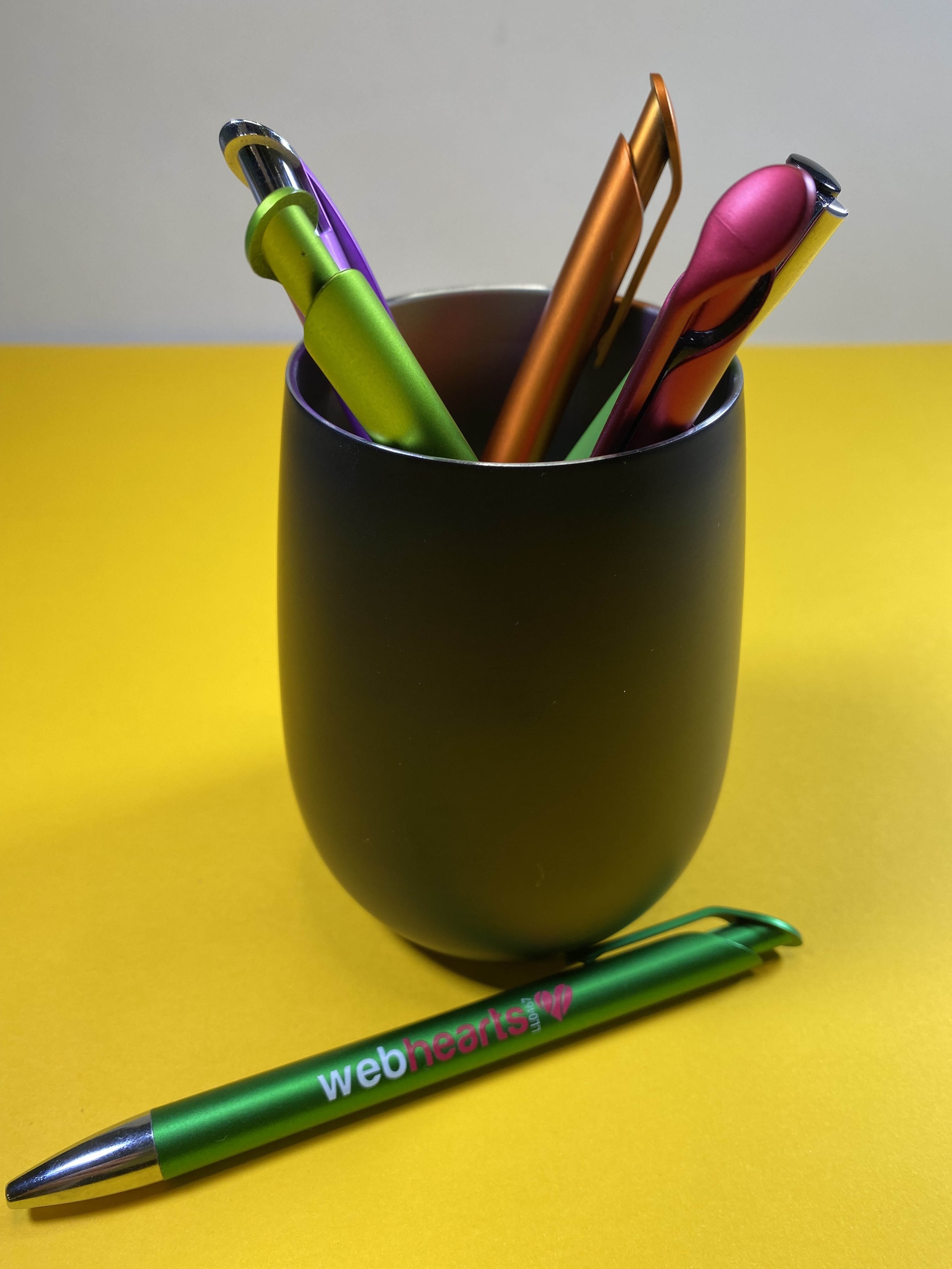 mug with pens in it
